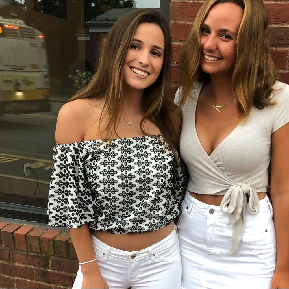 Off the shoulder black and white shirt.
